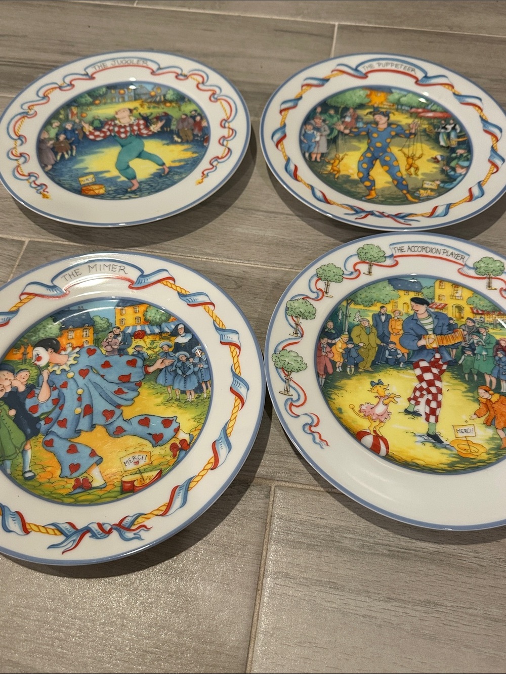 Joanna Hansen "Street Entertainers, Paris" whimsical clown and circus plates